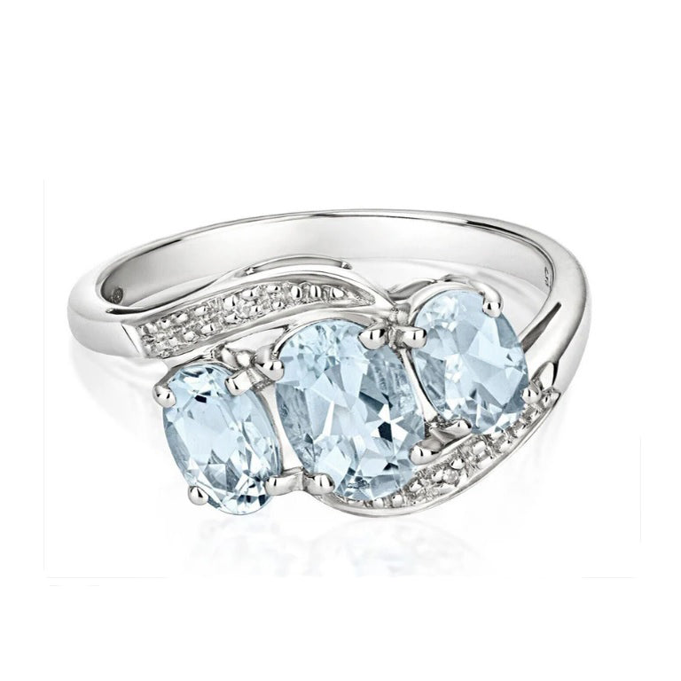 Elegant aquamarine diamond white gold ring with three oval aquamarine stones and diamond accents