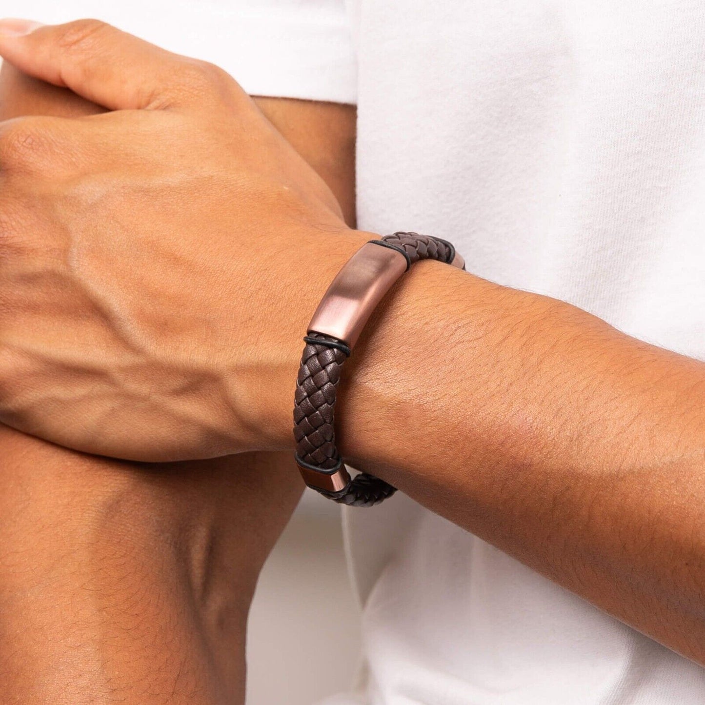 Fred Bennett brown leather bracelet with braided design and metal clasp worn on wrist