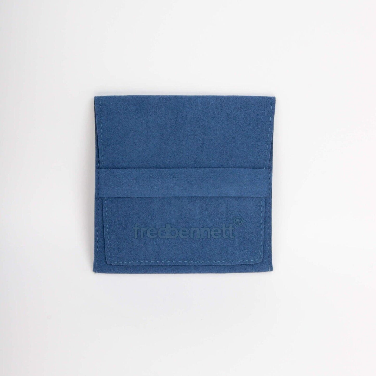 Blue suede pouch with fred bennett logo for storing Fred Bennett huggie hoop earrings