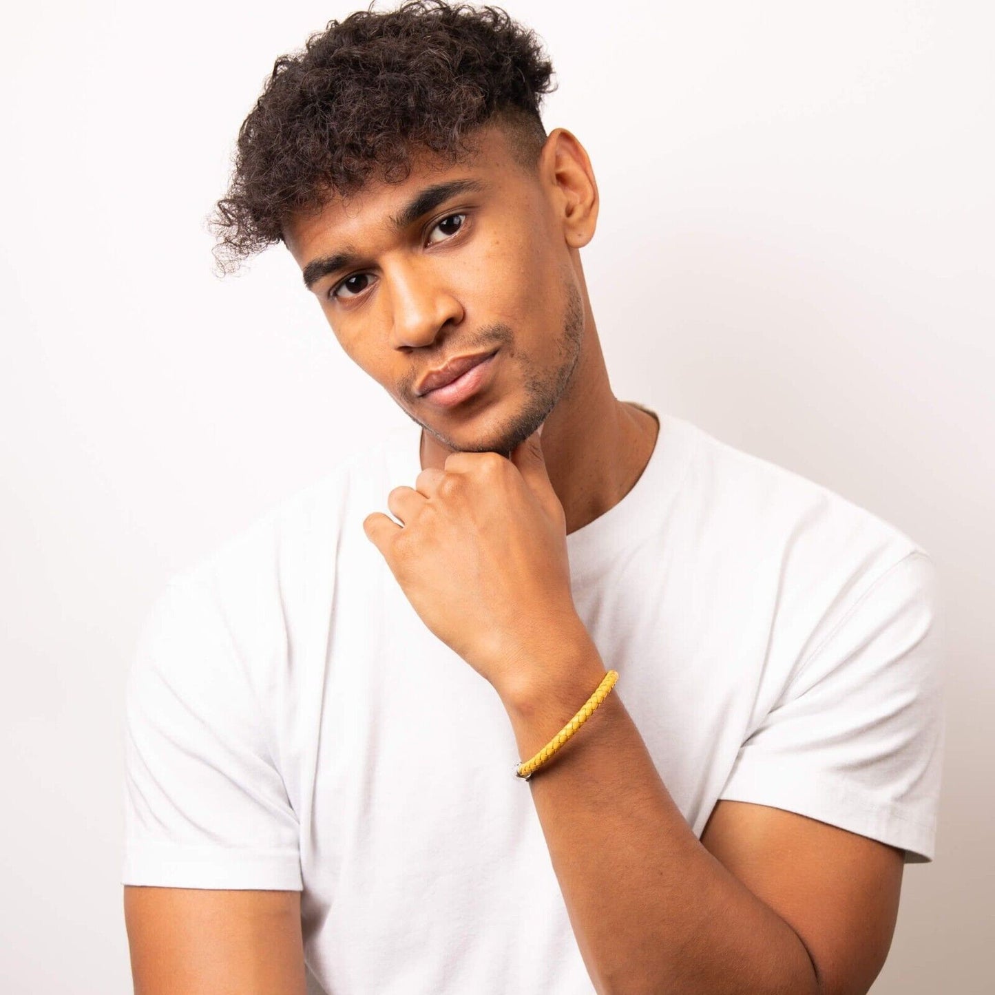 Fred Bennett mustard yellow bracelet worn by man with white t-shirt, stylish casual accessory