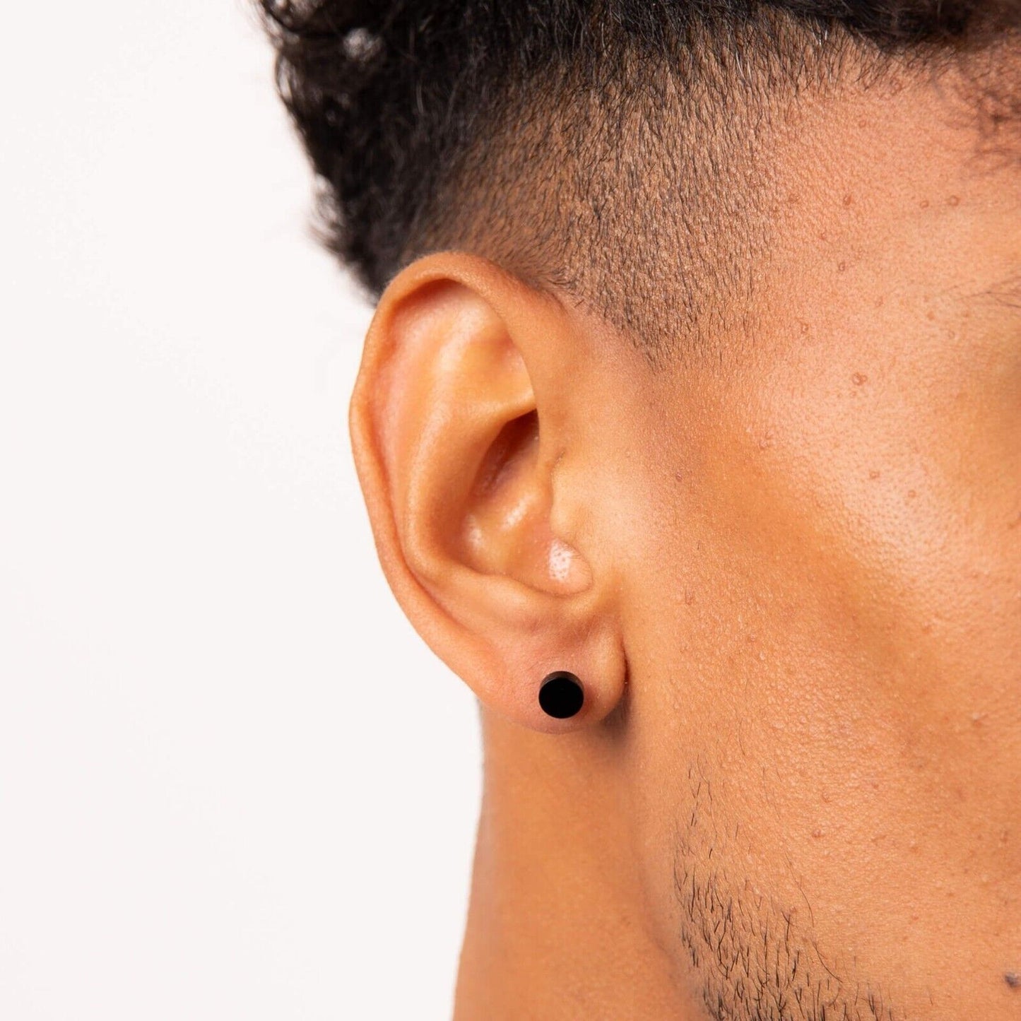 Fred Bennett black stud earring on man showcasing modern men's jewellery UK style