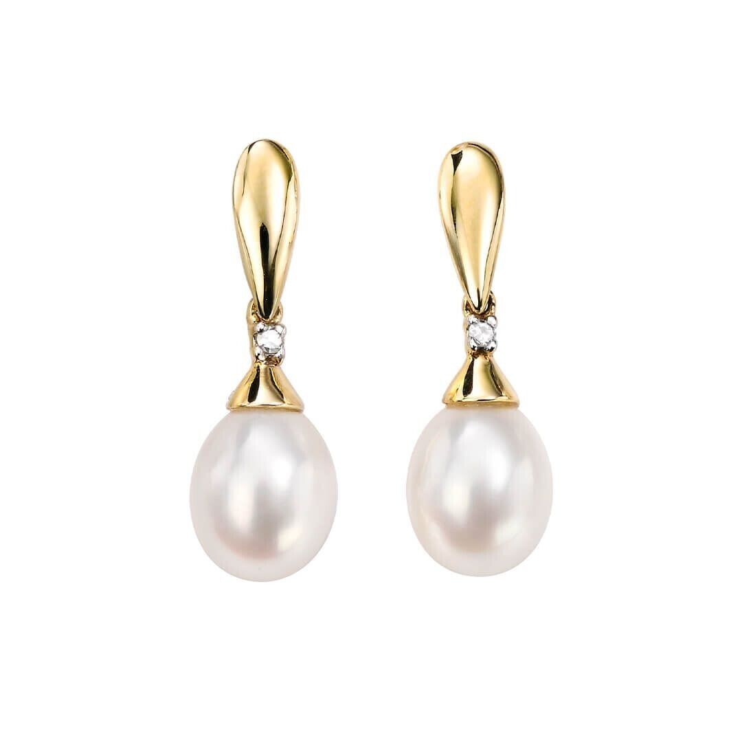 Freshwater pearl and diamond pendant set with gold detailing from J R Jewellery