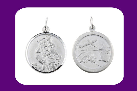 large sterling silver Saint Christopher pendant showing front Saint Christopher carrying child and reverse travel plane scene