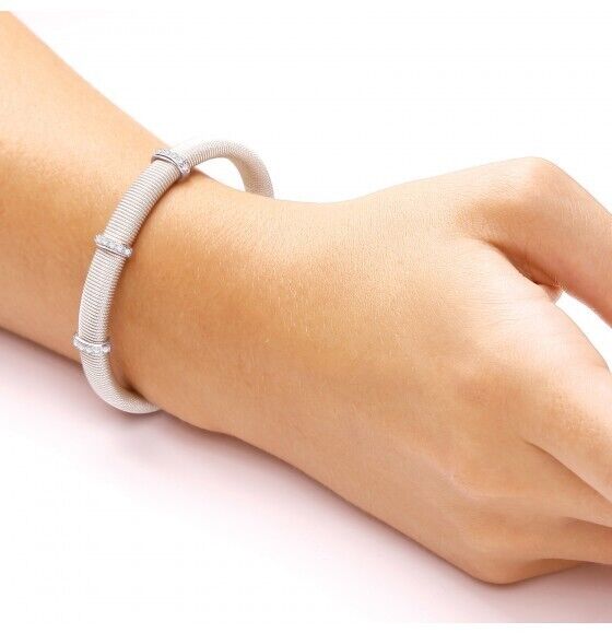 J R Jewellery sterling silver magnetic bangle worn on wrist with mesh design and decorative rings