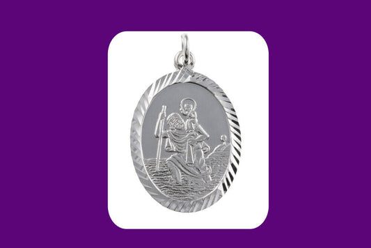 Oval silver St Christopher pendant with detailed engraved design and decorative border