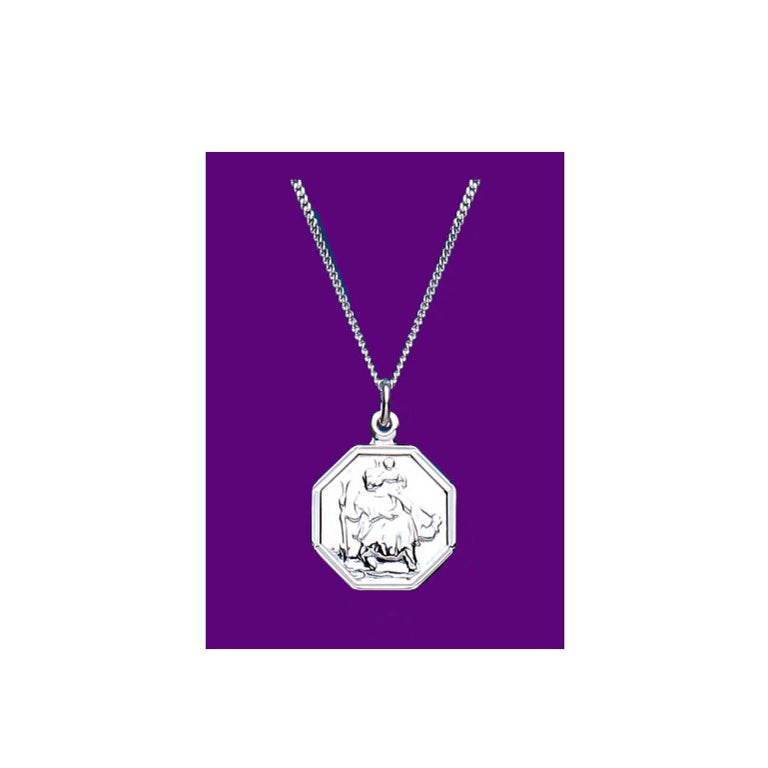 J R Jewellery sterling silver St Christopher pendant octagonal medal on curb chain against purple