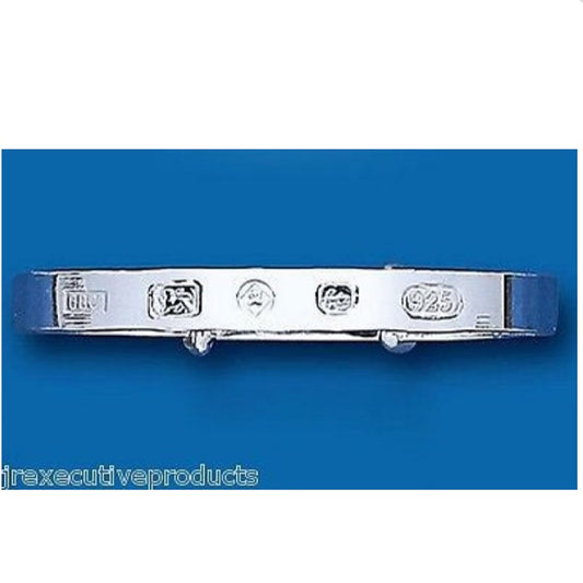 J R Jewellery sterling silver baby bangle with hallmark stamps on blue background