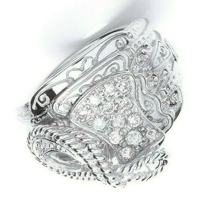 Intricately designed sterling silver gents saddle ring with detailed patterns and sparkling stones by J R Jewellery