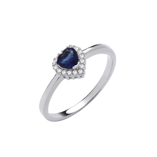 Sterling silver sapphire heart ring with a deep blue heart-shaped sapphire surrounded by sparkling clear stones