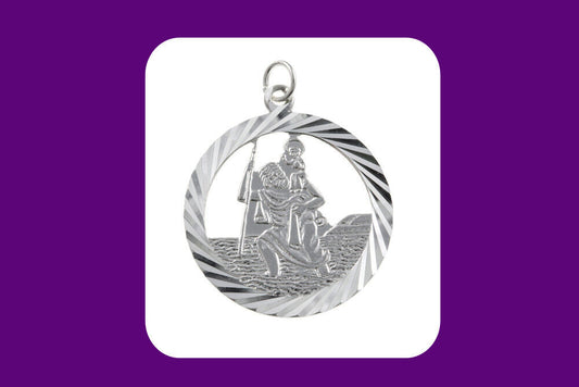 Detailed sterling silver St Christopher pendant featuring a figure carrying a child across water