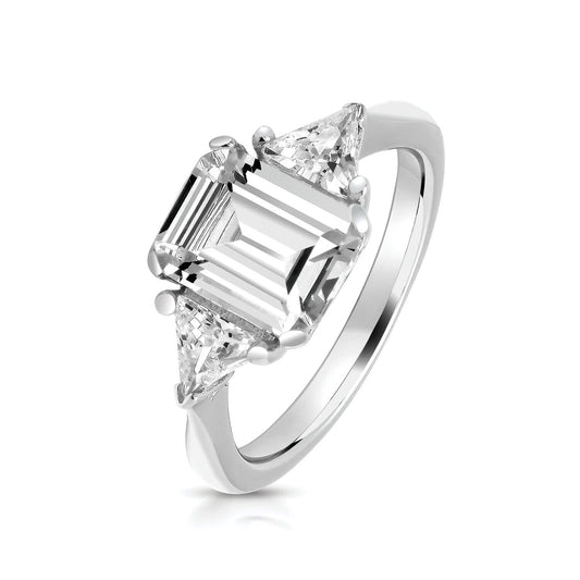 J R Jewellery sterling silver trilogy ring with emerald cut centre stone and two triangular side stones