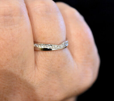 J R Jewellery sterling silver wishbone eternity ring with small sparkling stones on a finger