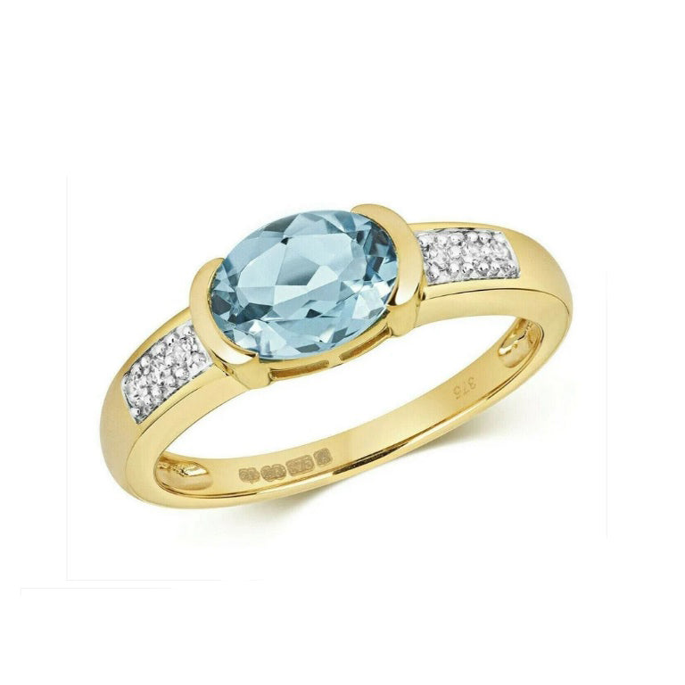J R Jewellery gold ring featuring a Swiss blue topaz diamond ring with oval blue topaz and diamond accents