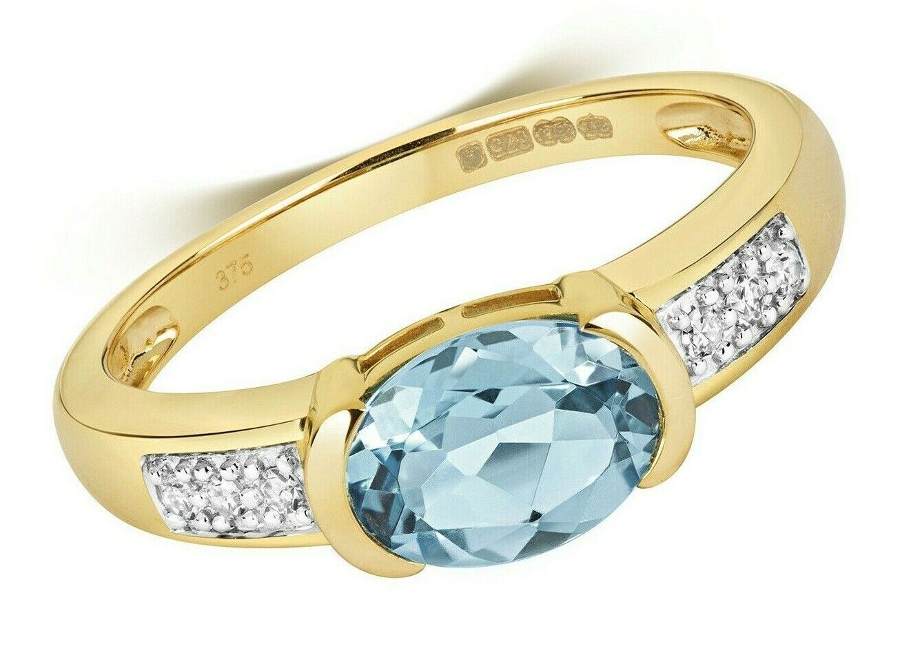 J R Jewellery Swiss blue topaz diamond ring with oval blue topaz and diamond accents in gold band