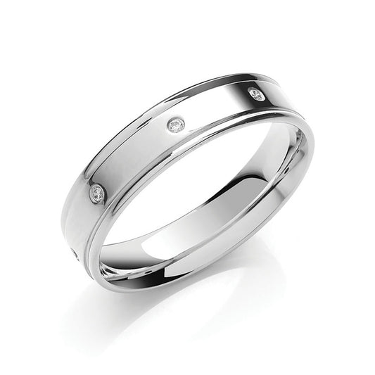 J R Jewellery white gold diamond wedding band with three small diamonds embedded in a polished surface