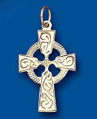 Yellow gold Celtic cross pendant with intricate Celtic knot designs on a blue background