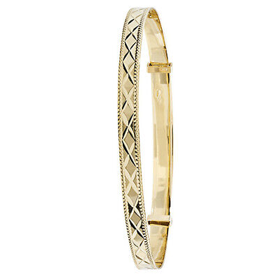 J R Jewellery yellow gold ladies bangle with engraved geometric pattern and smooth polished finish
