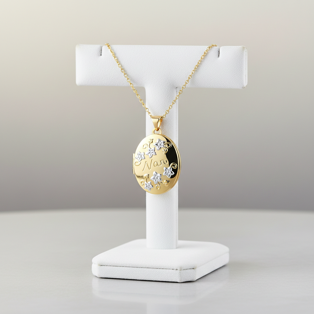 18ct Gold NAN Oval Locket on a delicate chain displayed on a white jewellery stand