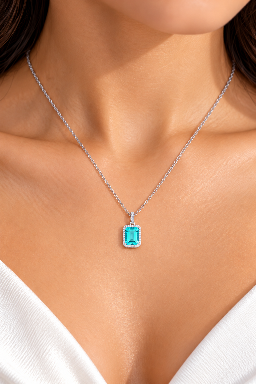 Emerald-Cut Blue Topaz Pendant with Sparkling Diamond Halo 9ct White Gold 18"