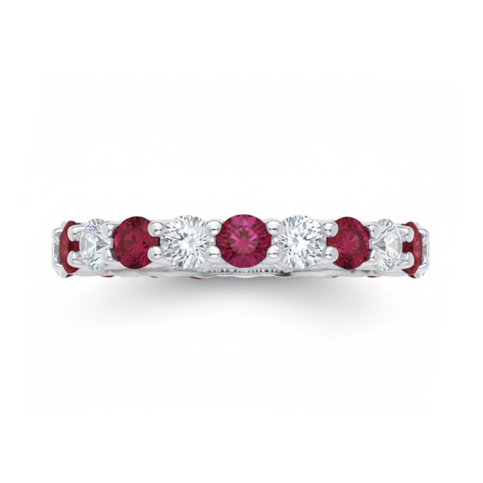 Eternity ring with red gemstones and diamonds on a white background