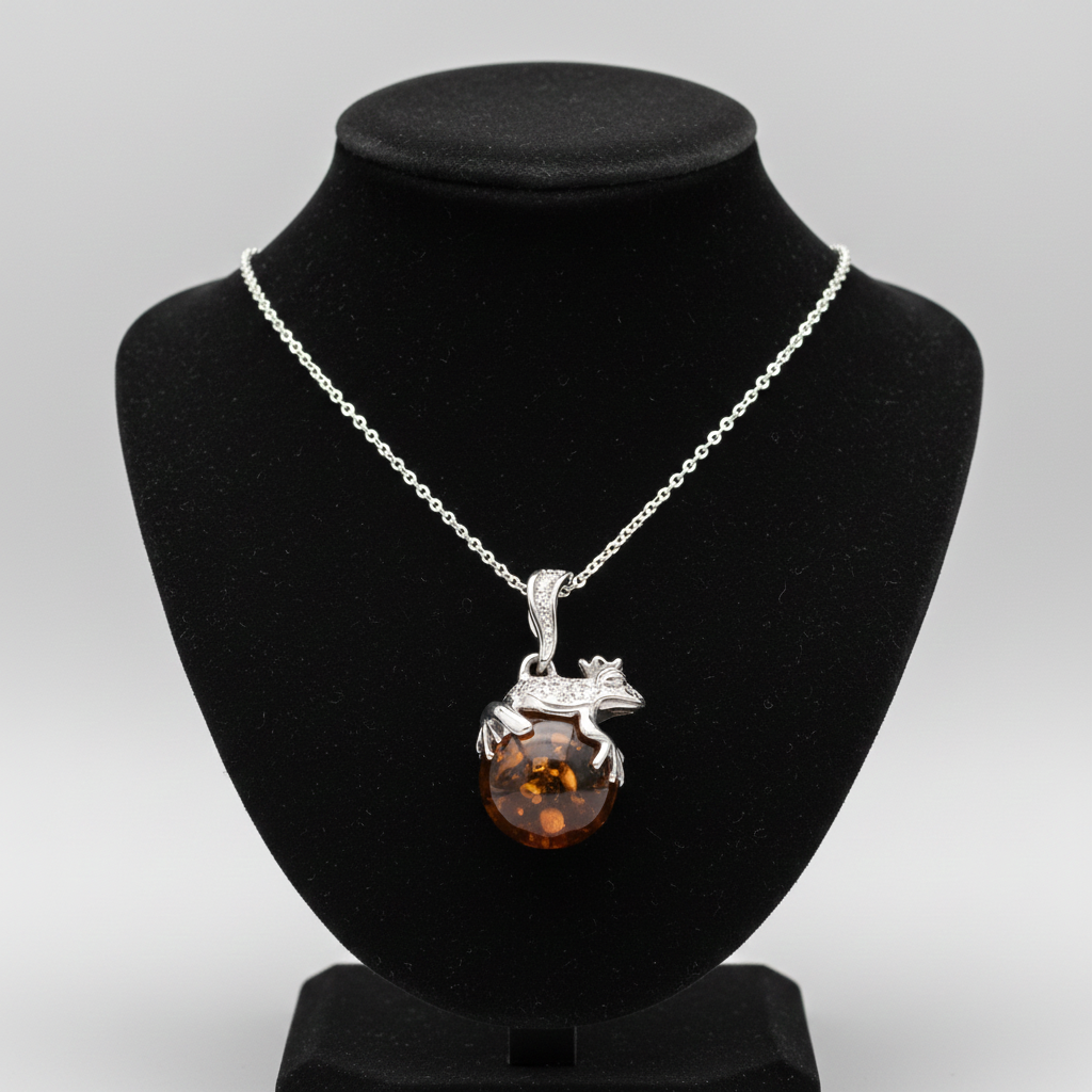 Silver Necklace featuring an Amber Frog Pendant on a black display stand