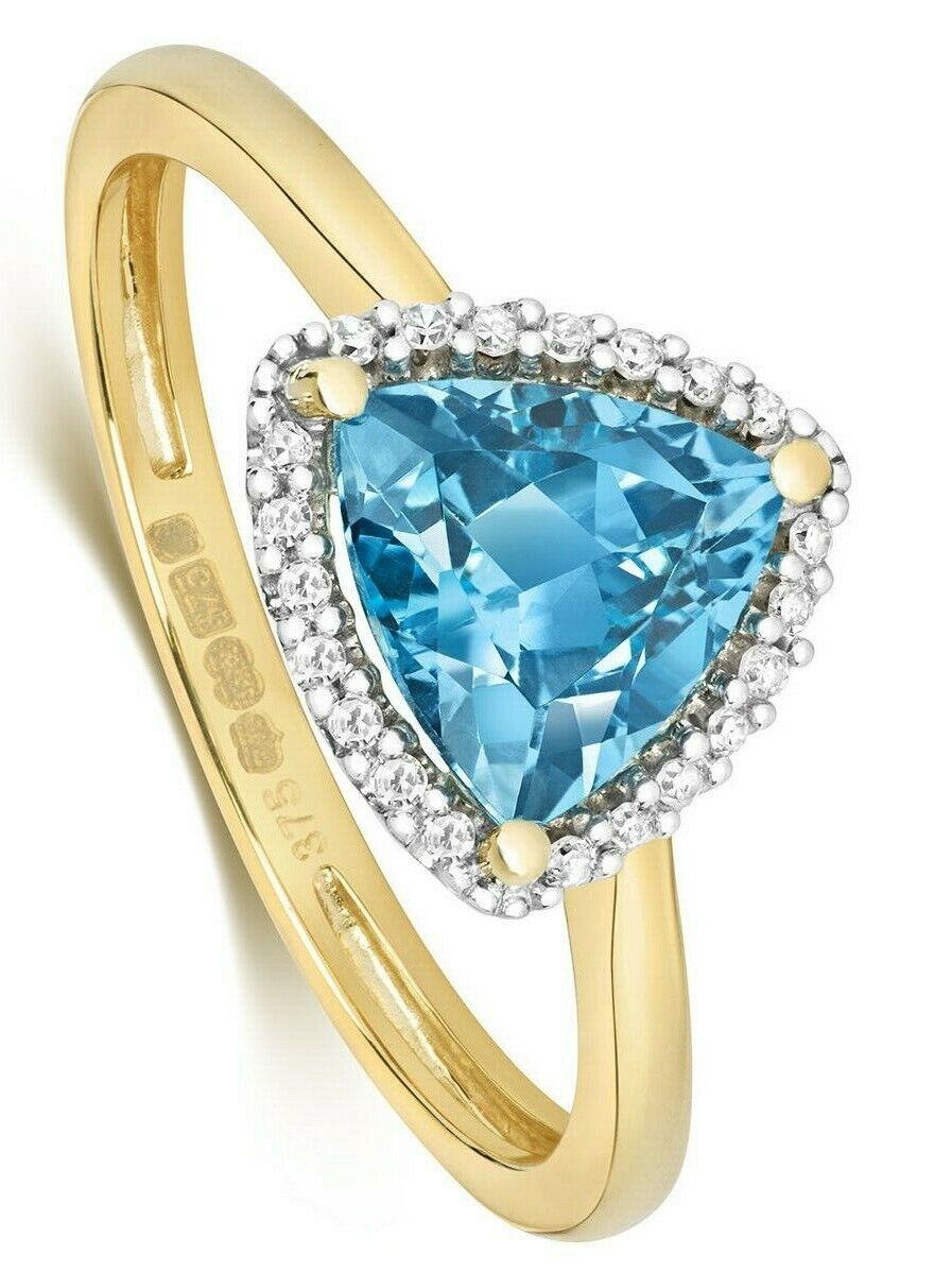 Stunning blue topaz and diamond ring set in gold with a triangular gemstone design