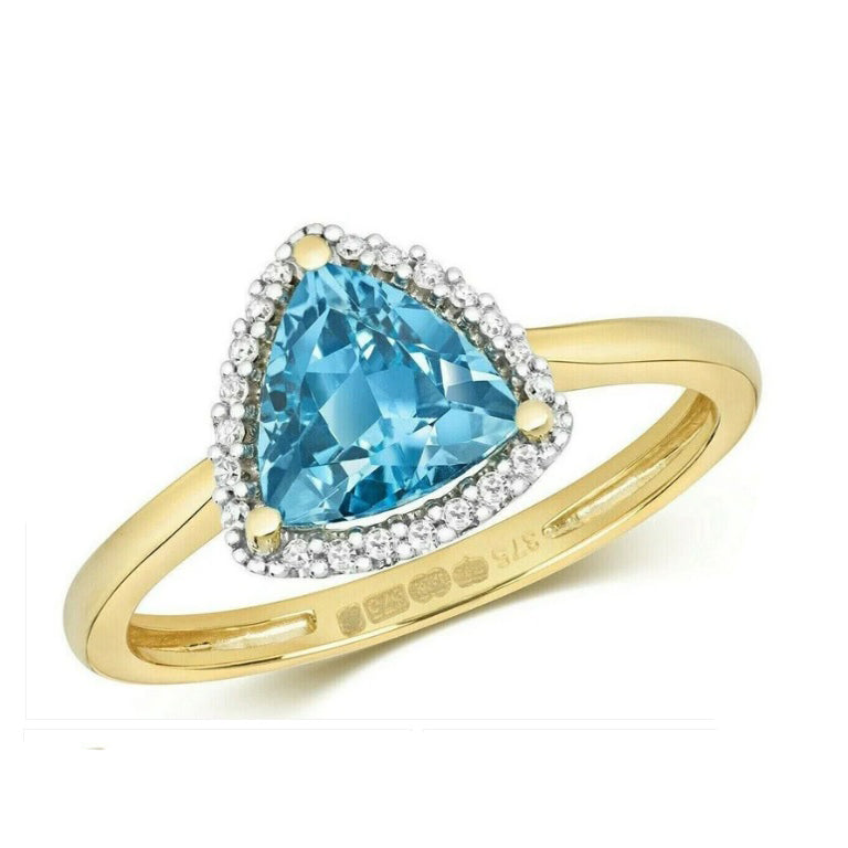 Elegant blue topaz and diamond ring with a triangular cut stone and diamond accents in a gold setting
