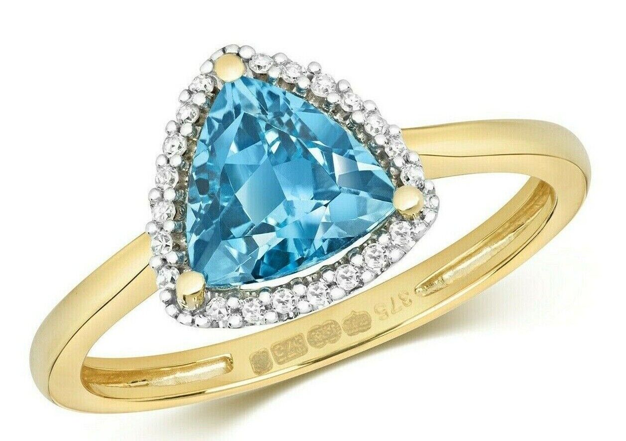 Elegant blue topaz and diamond ring set in gold, featuring a triangular blue topaz stone surrounded by diamonds