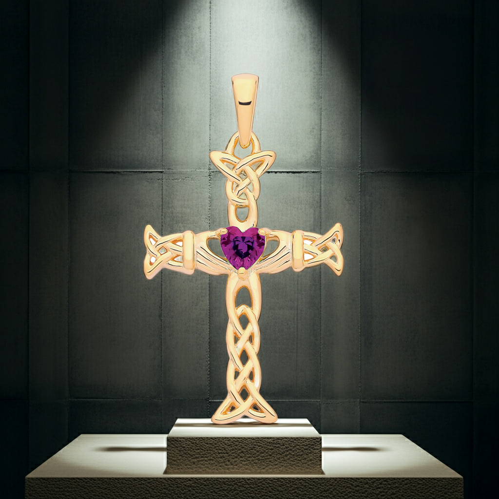 Elegant gold Claddagh Celtic Cross pendant featuring a heart-shaped gem in the centre