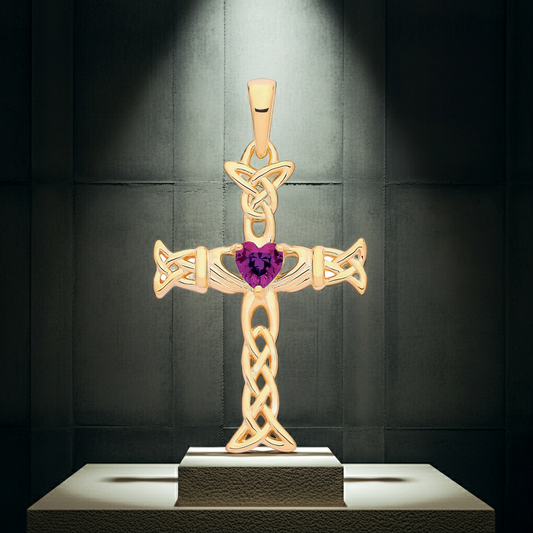 Elegant gold Claddagh Celtic Cross pendant featuring a heart-shaped gem in the centre