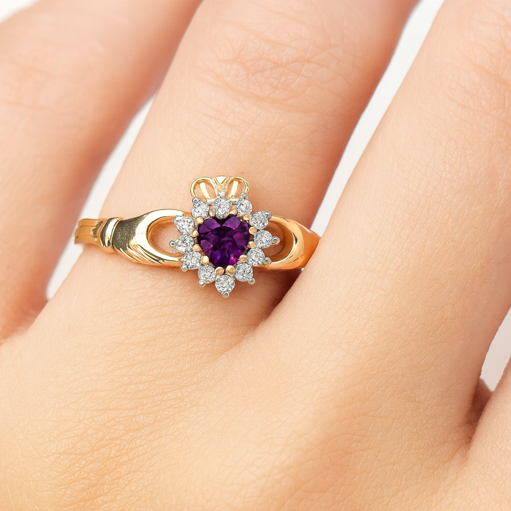 J R Jewellery Claddagh Ring with Purple Centre Stone and Sparkling Accents on a Gold Band