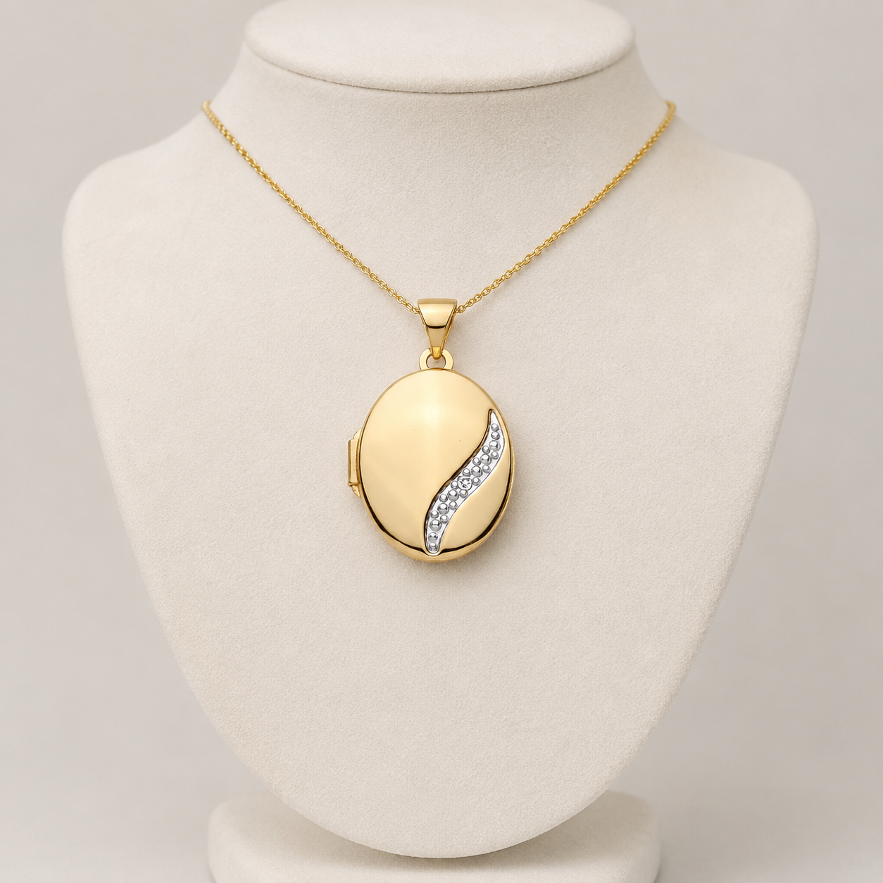 Elegant Oval Locket by J R Jewellery with glittering detail on a gold chain