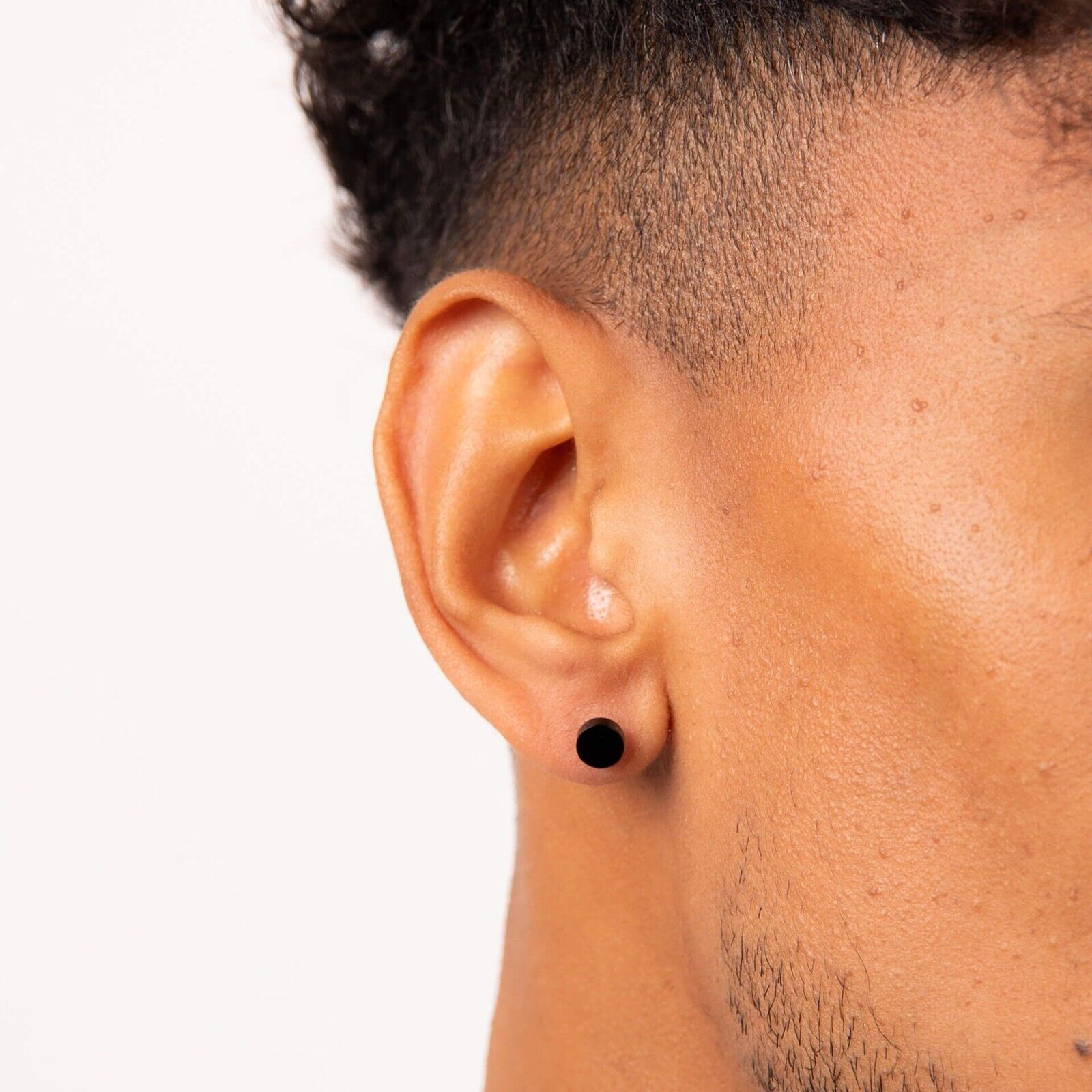 Fred Bennett black stud earring on man showcasing modern men's jewellery UK style