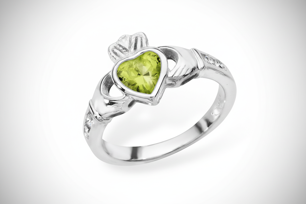 Irish Claddagh Ring in Silver featuring a Heart-Shaped Green Stone and Elegant Design