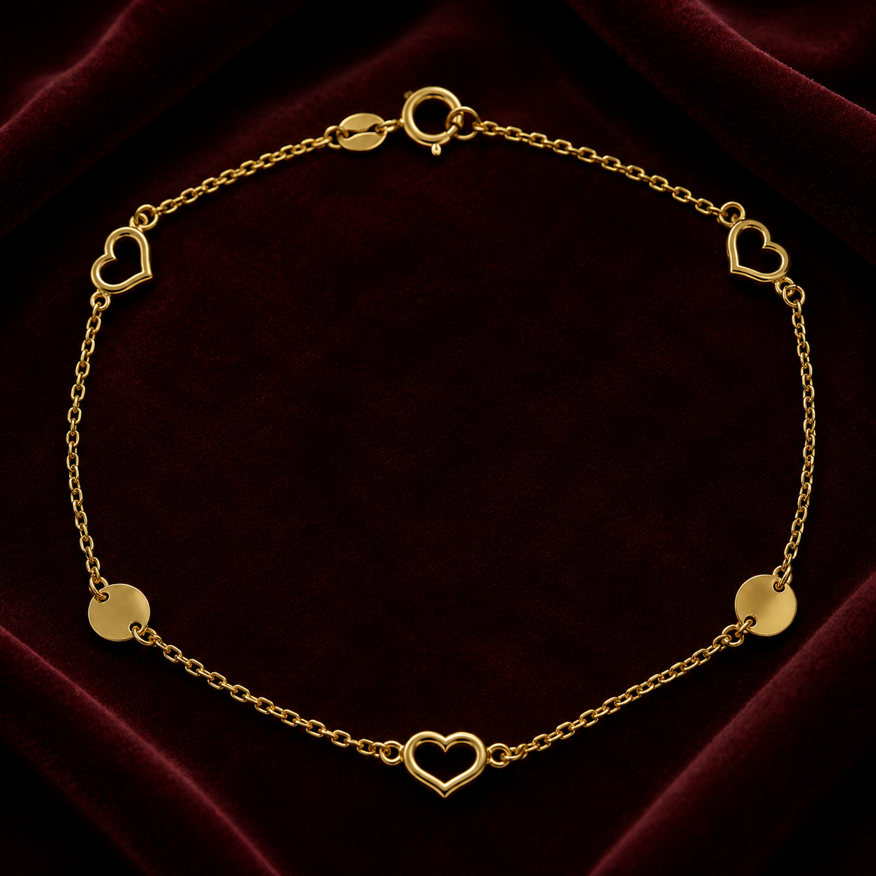 Ladies 9ct Yellow Gold Open Heart Station Bracelet with heart and disc details on a delicate chain