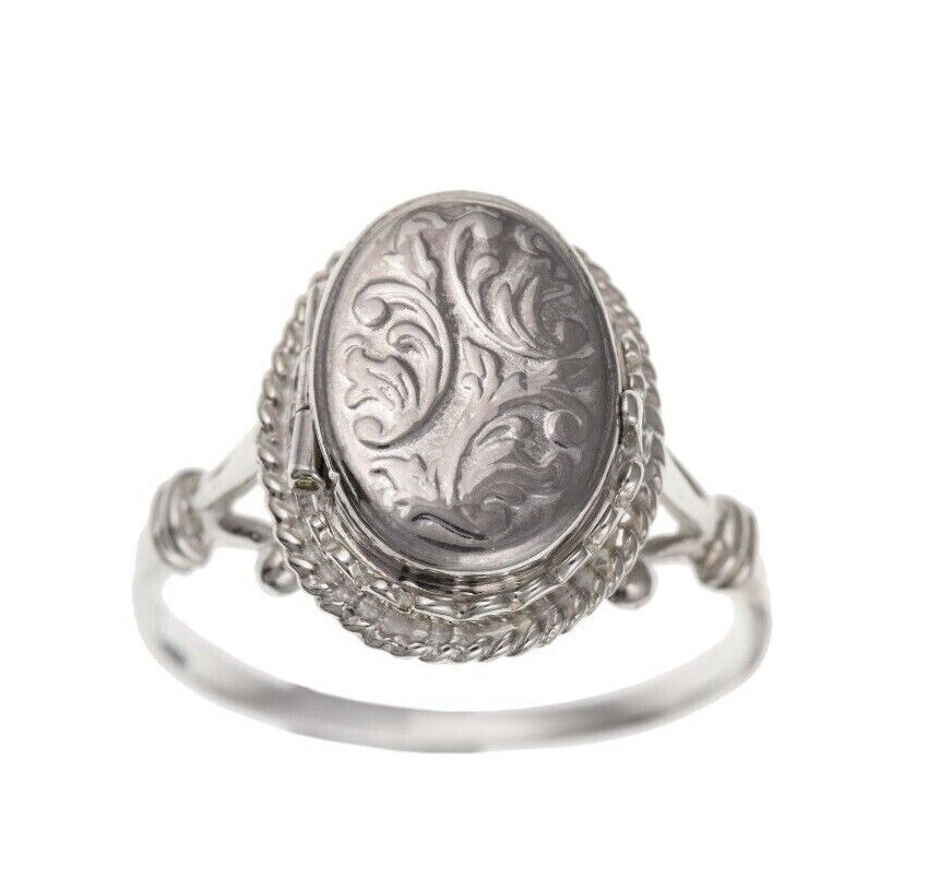 Ladies Sterling Silver Oval Locket Ring with intricate floral engravings and a polished finish
