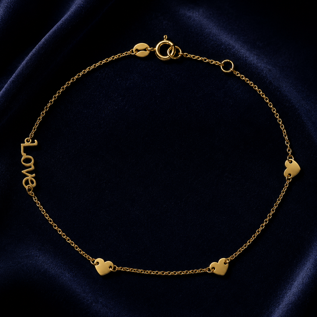 Love Script Bracelet In 9ct Yellow Gold featuring delicate hearts and elegant lettering