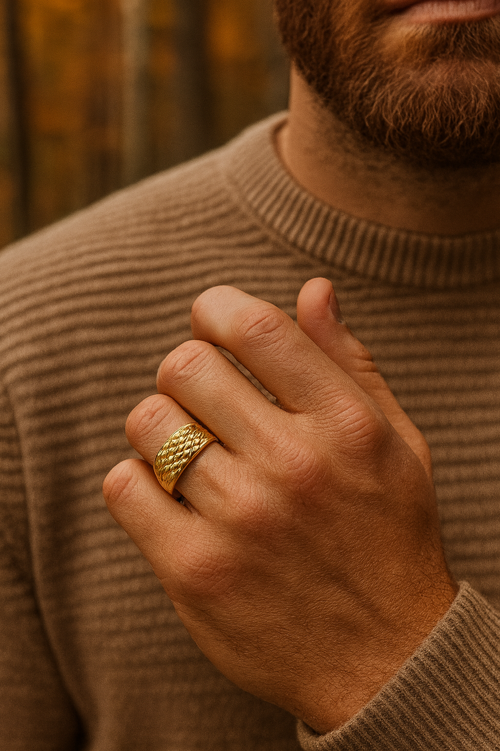 Men's 4 Row Keeper Ring in gold worn by a man, showcasing its textured design and robust style