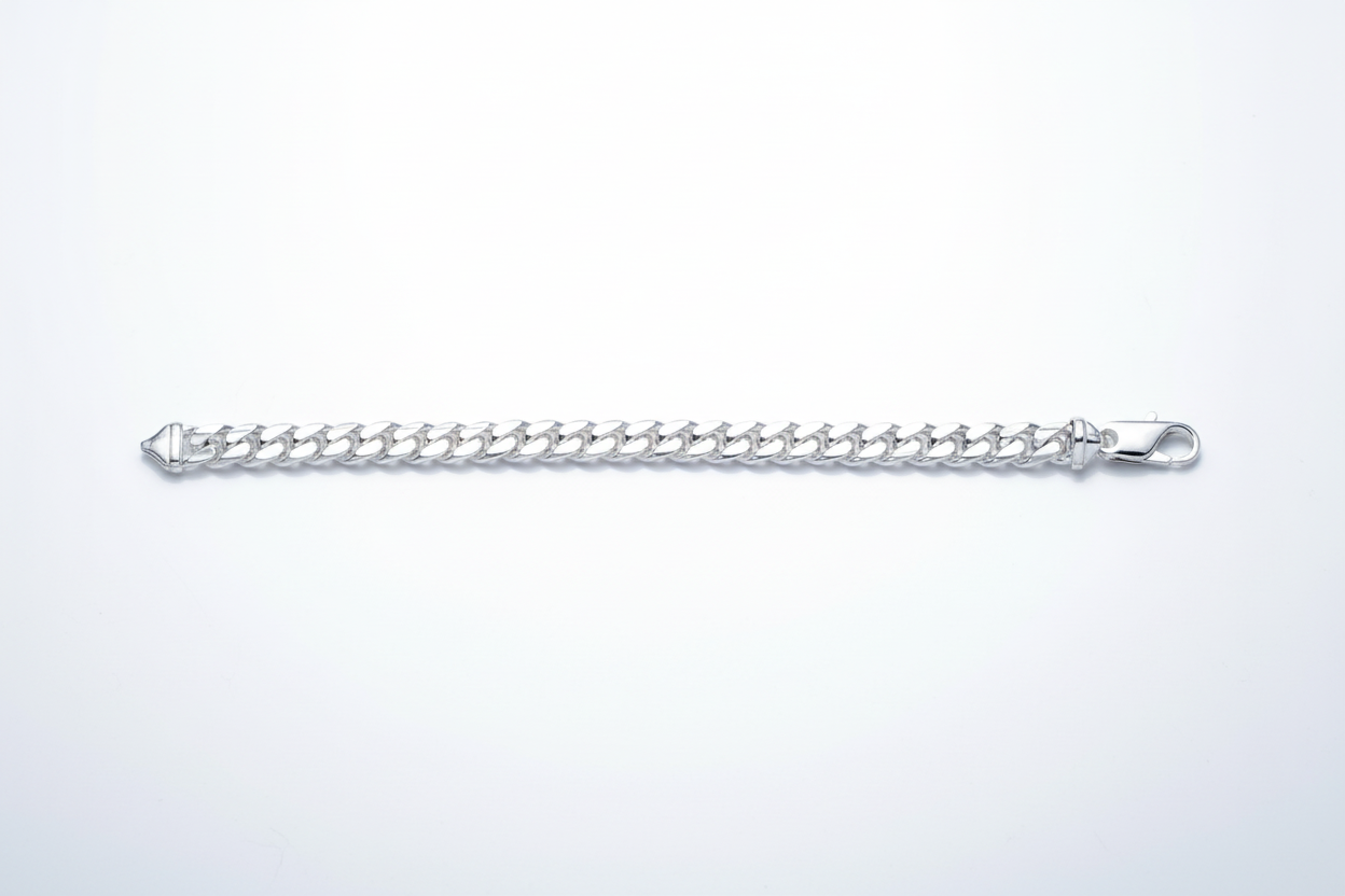A sterling silver curb chain bracelet with a box clasp.
