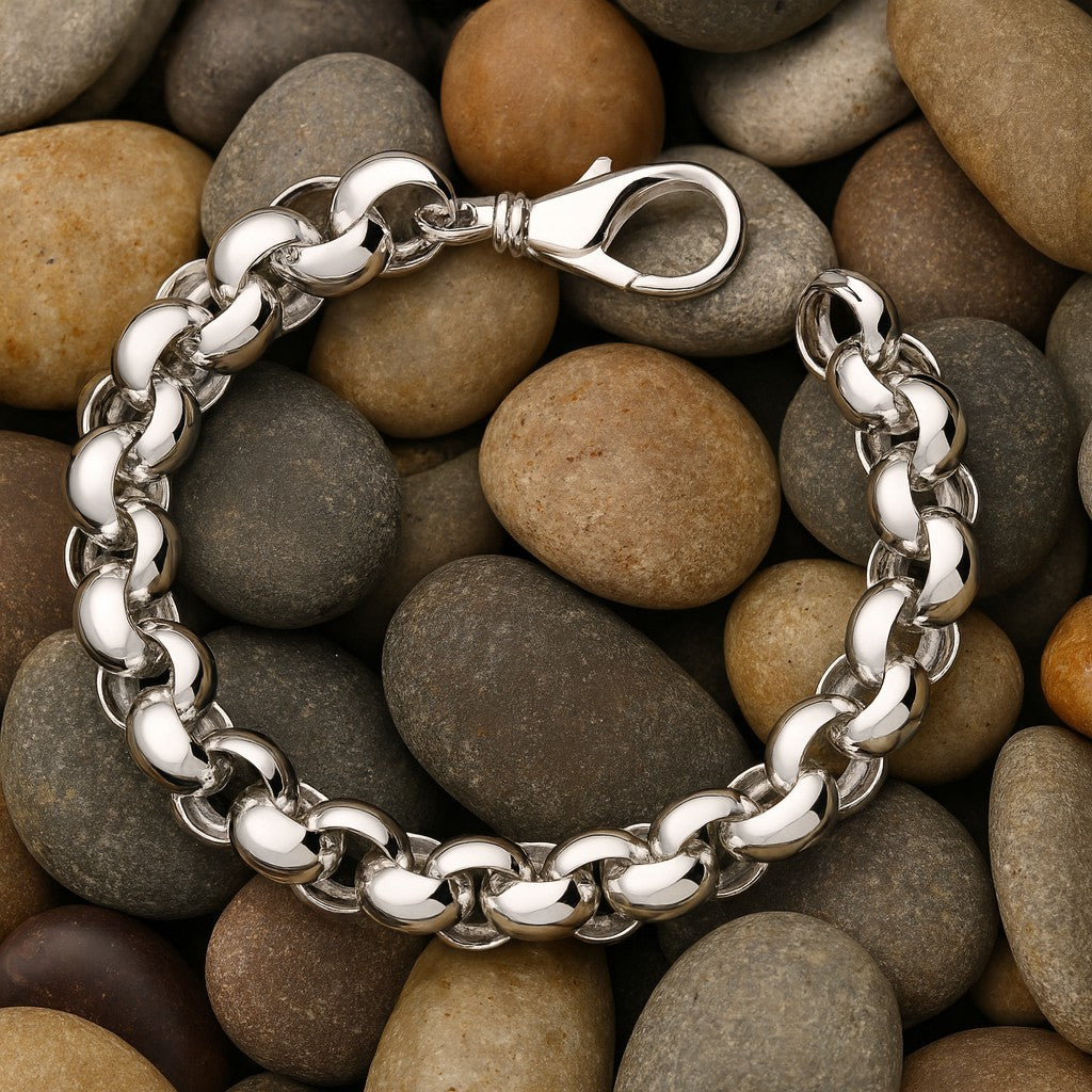 Mens Heavy Belcher Bracelet Solid Silver featuring a robust design and secure clasp on smooth pebbles