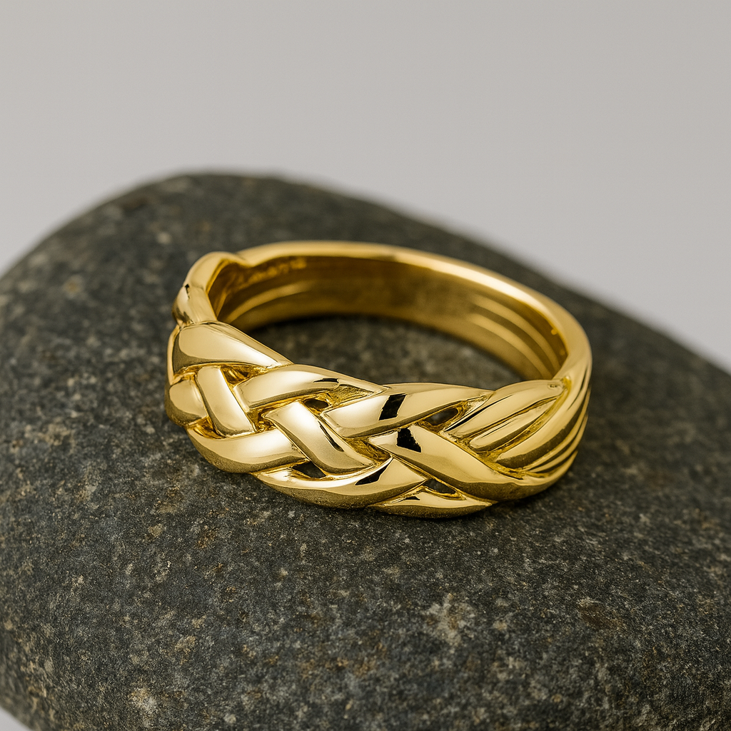 Mens Puzzle Ring 24ct Yellow Gold with a braided design displayed on a smooth stone