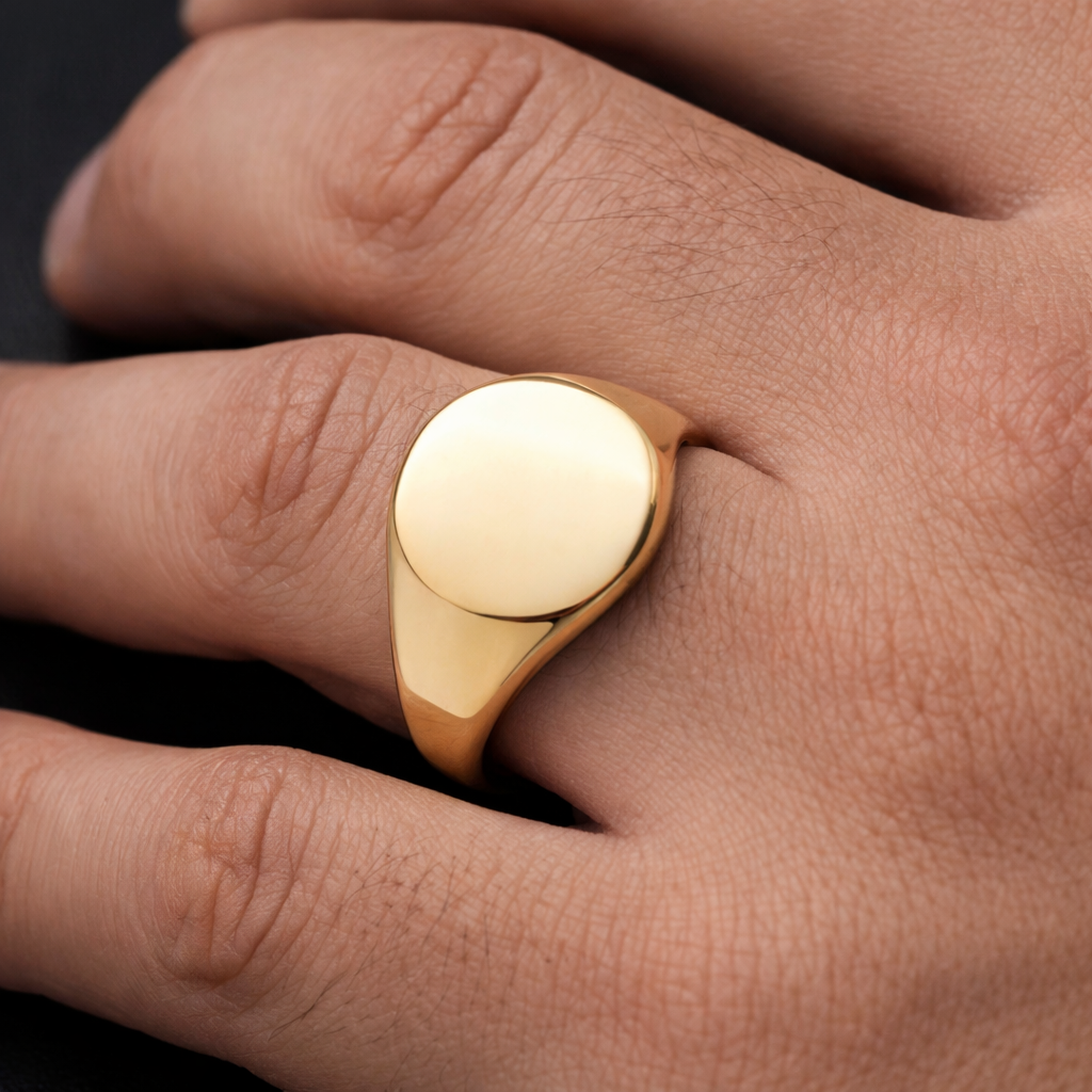 Mens Yellow Gold Oval Signet Ring on Solid Sterling Silver displayed on a hand, showcasing its elegant design