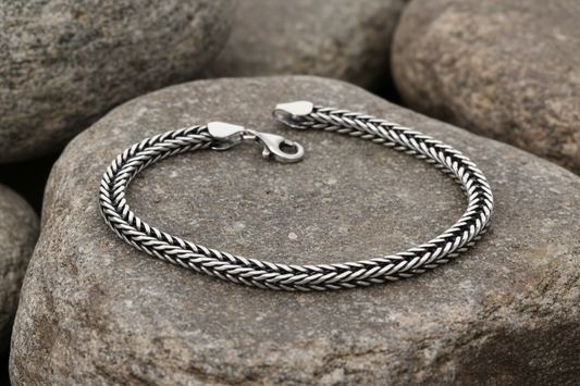 A sterling silver oxidised foxtail chain bracelet with a length of 22cm.