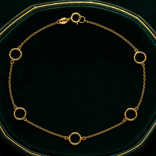 J R Jewellery Open Circle Station Bracelet in gold with linked circular charms for elegant style