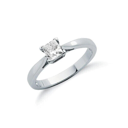 Elegant princess cut diamond solitaire ring set in a simple platinum band for a timeless look