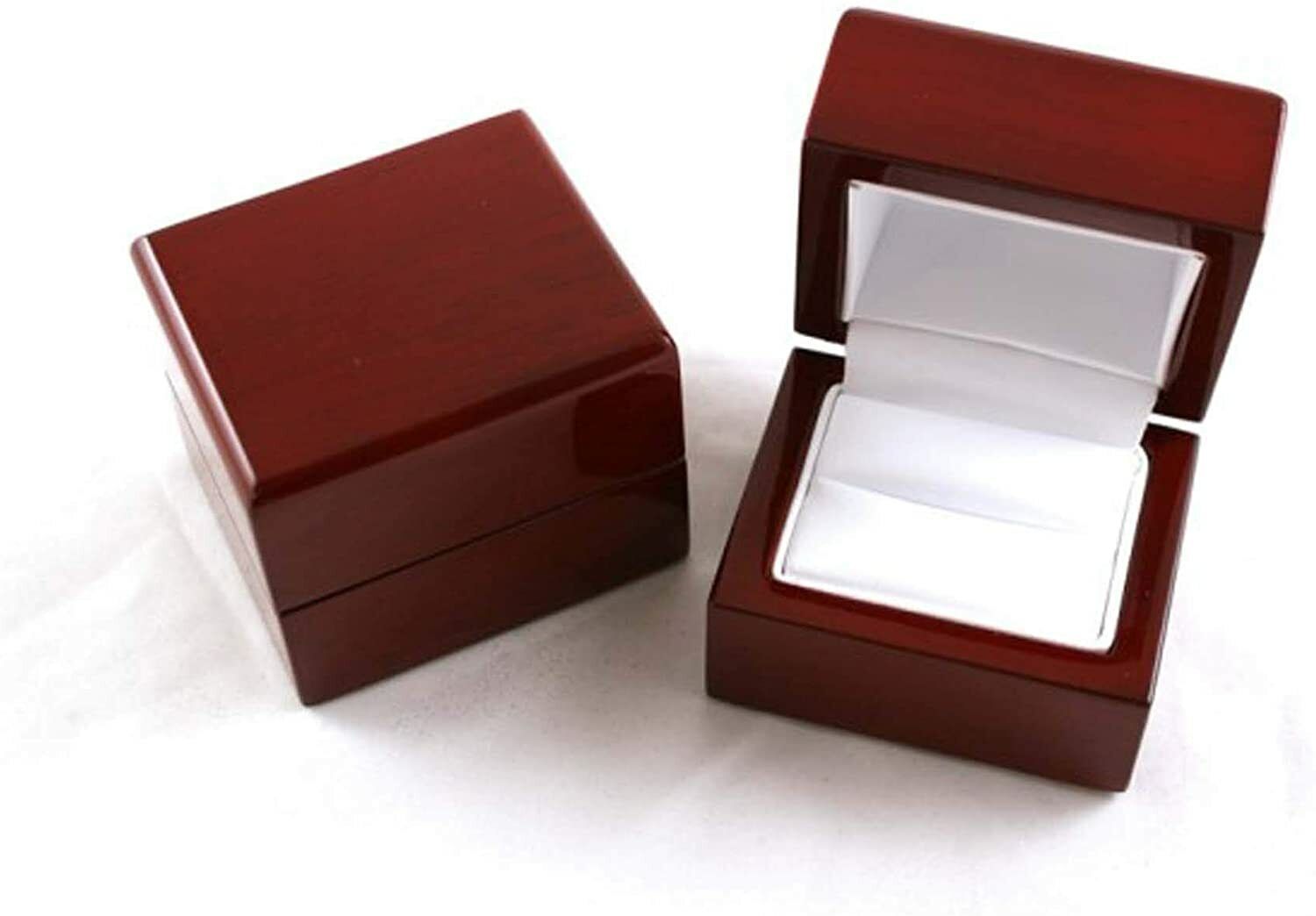 Elegant wooden ring box for a princess cut diamond solitaire ring featuring a soft interior lining