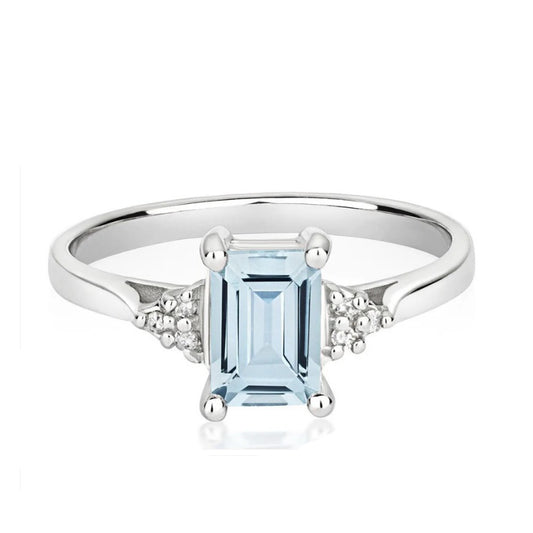 Elegant real aquamarine and diamond ring with a stunning emerald cut stone and sparkling accents