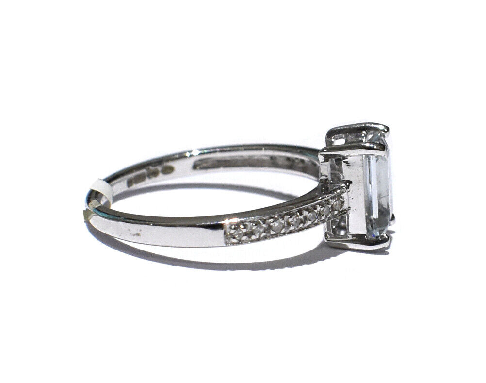 Real Aquamarine and Diamond Ring set in silver with a sparkling band and elegant design