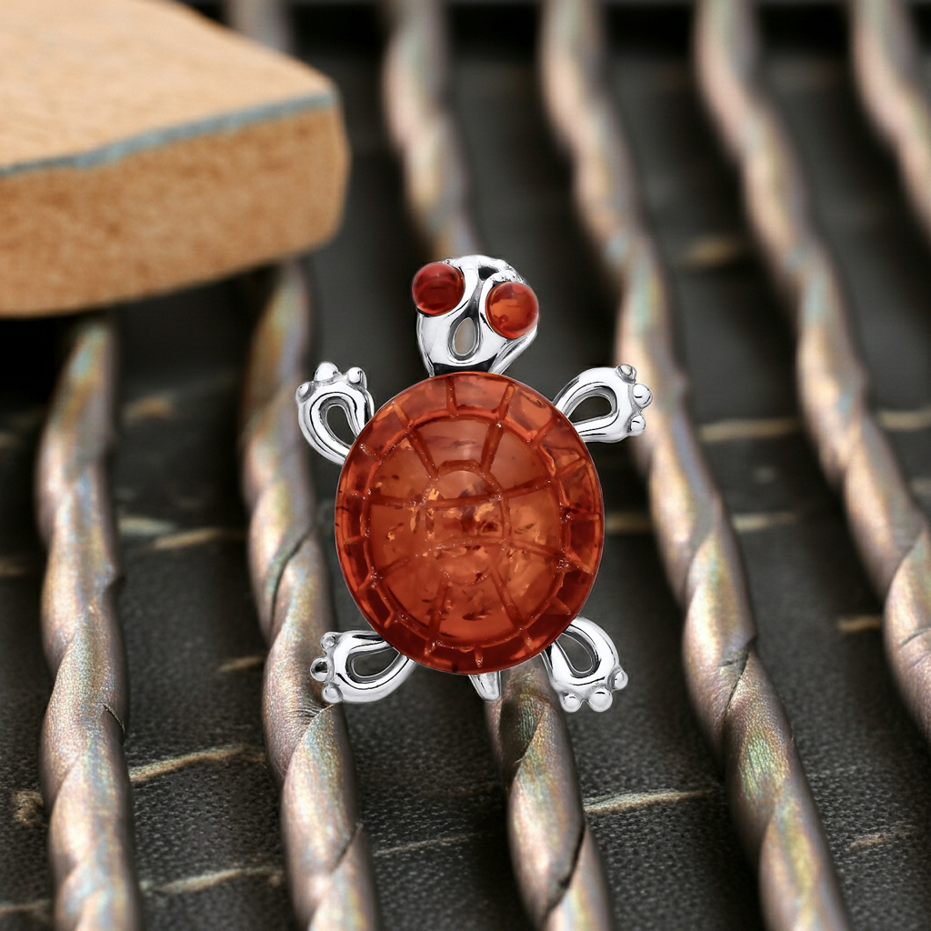 J R Jewellery Silver Necklace featuring a turtle design with orange gemstone and detailed sterling accents
