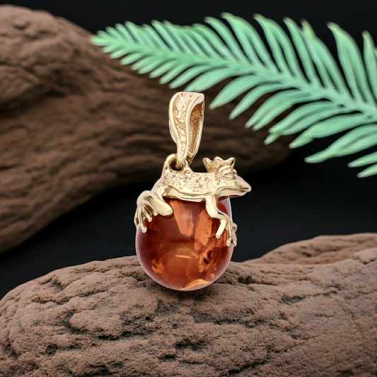 J R Jewellery silver necklace featuring a frog pendant with a crystal orb design